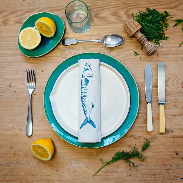Seafood-themed napkins by Lottie Day with lobster and mussel prints, perfect for coastal kitchen decor