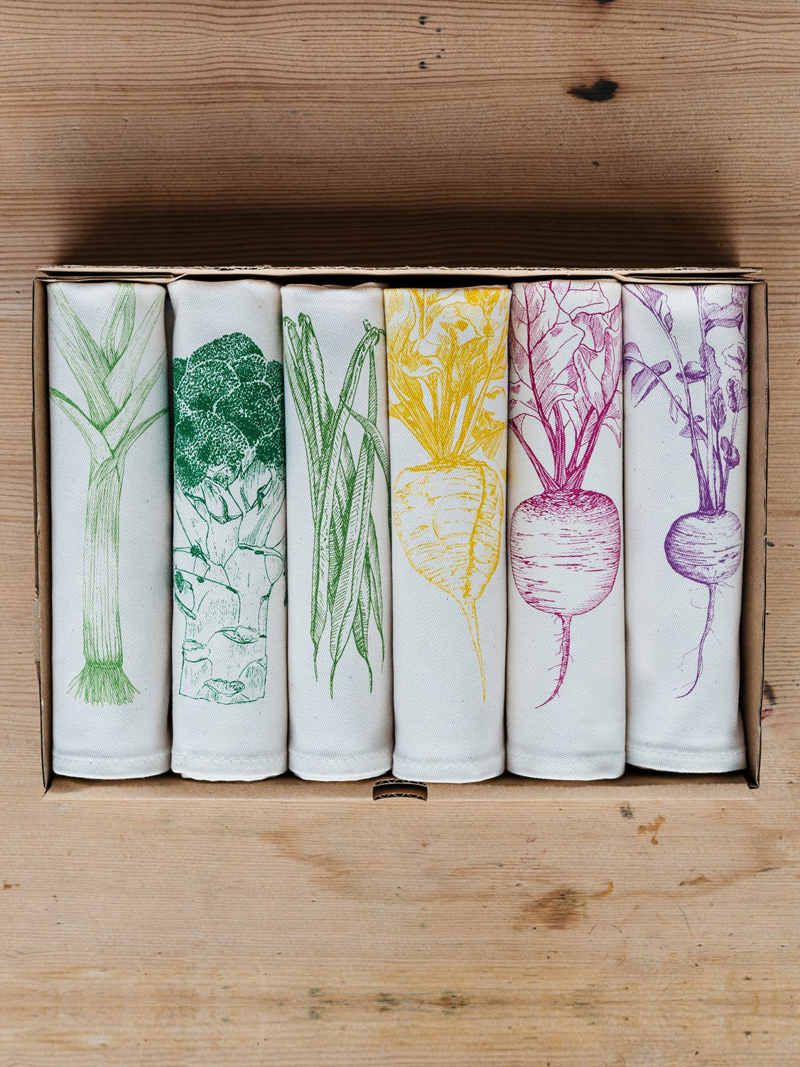 Allotment vegetable napkin set by Lottie Day - handmade cotton napkins featuring screen-printed garden vegetables including beetroot and leek