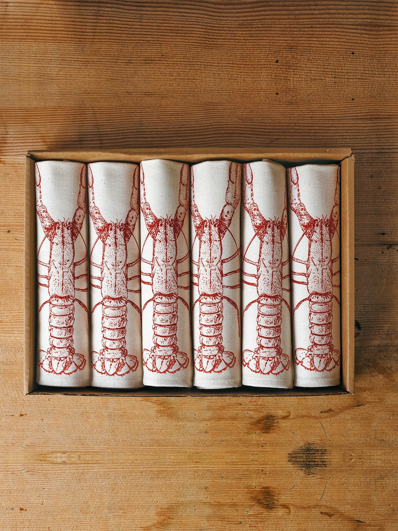 Red Lobster napkin gift set by Lottie Day – handmade cotton napkins with coastal seafood illustration, inspired by Norfolk