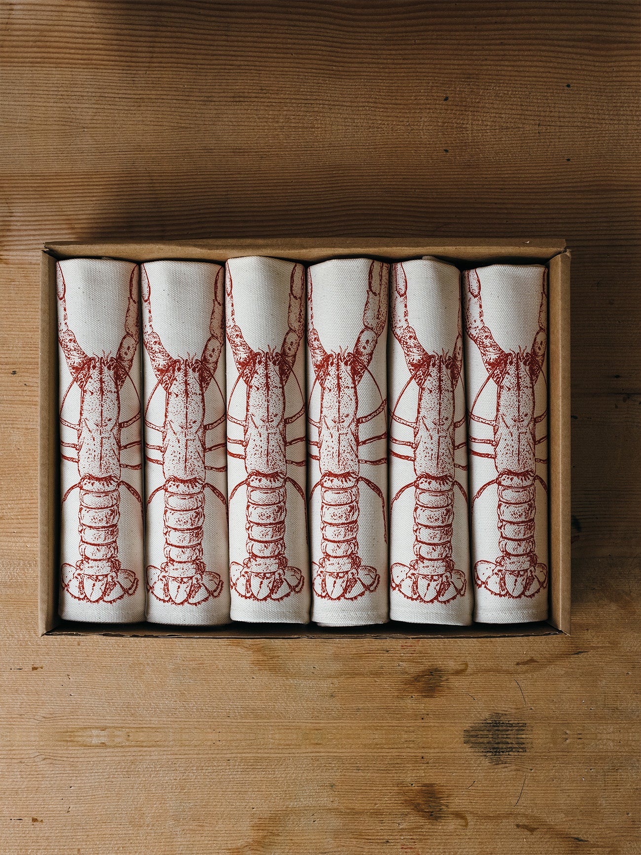 Red Lobster napkin gift set by Lottie Day – handmade cotton napkins with coastal seafood illustration, inspired by Norfolk