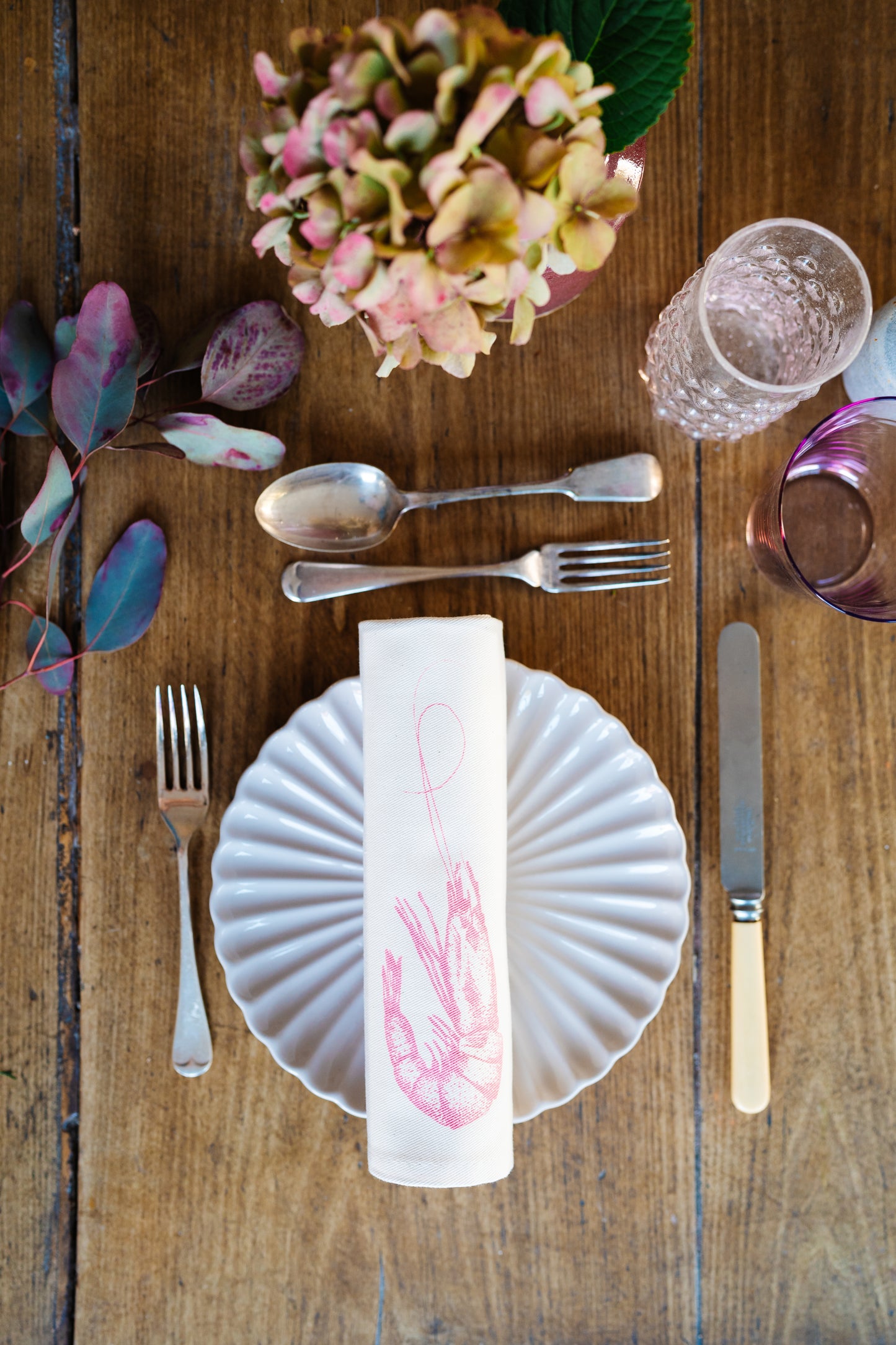 Seafood napkin gift set by Lottie Day featuring handprinted crab, blue lobster, prawn, mackerel, samphire and lemon illustrations on cotton napkins