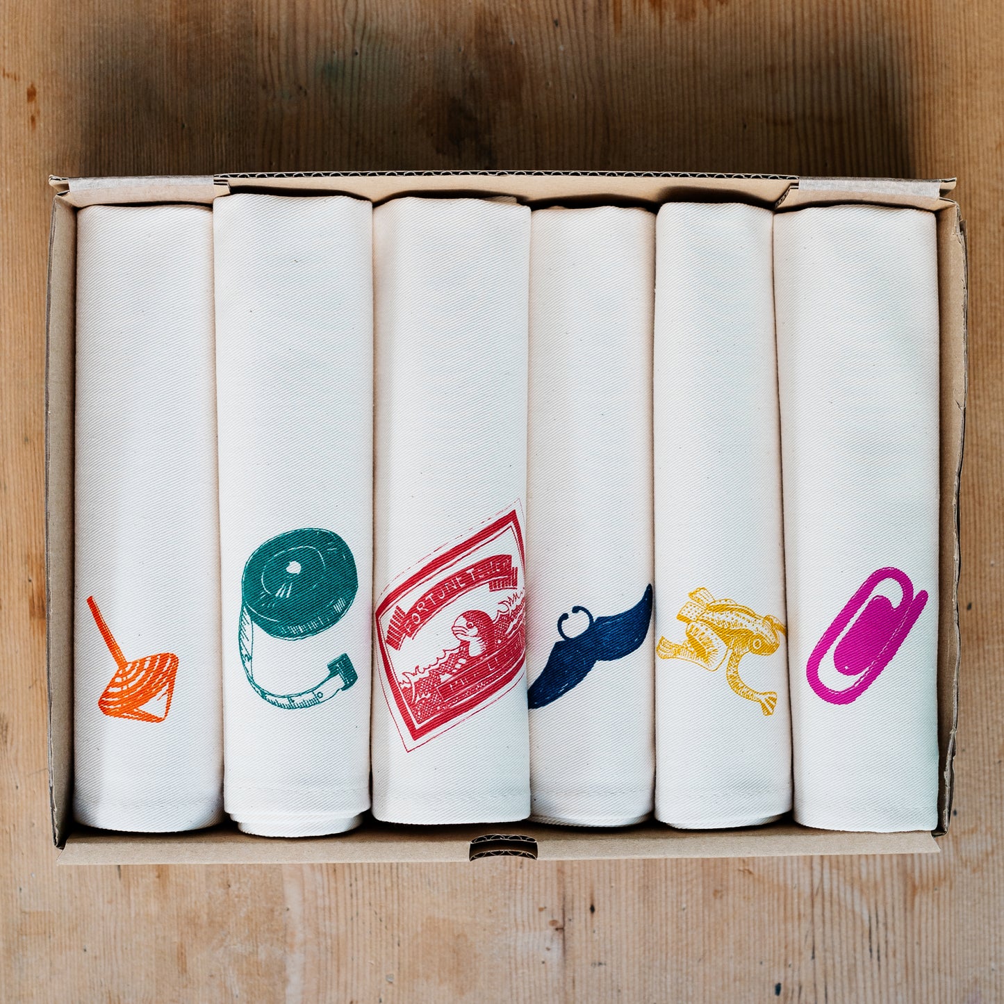 Christmas Cracker napkin set by Lottie Day – six cotton napkins with festive prints and hidden surprise designs