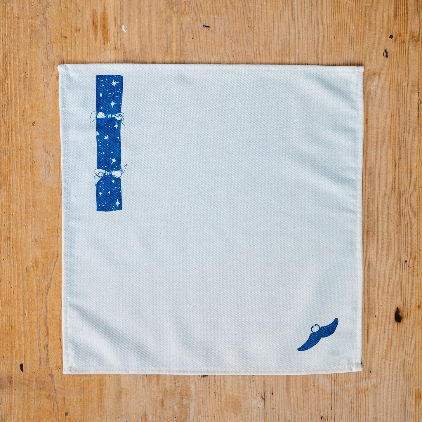 Christmas Cracker napkin set by Lottie Day – six cotton napkins with festive prints and hidden surprise designs