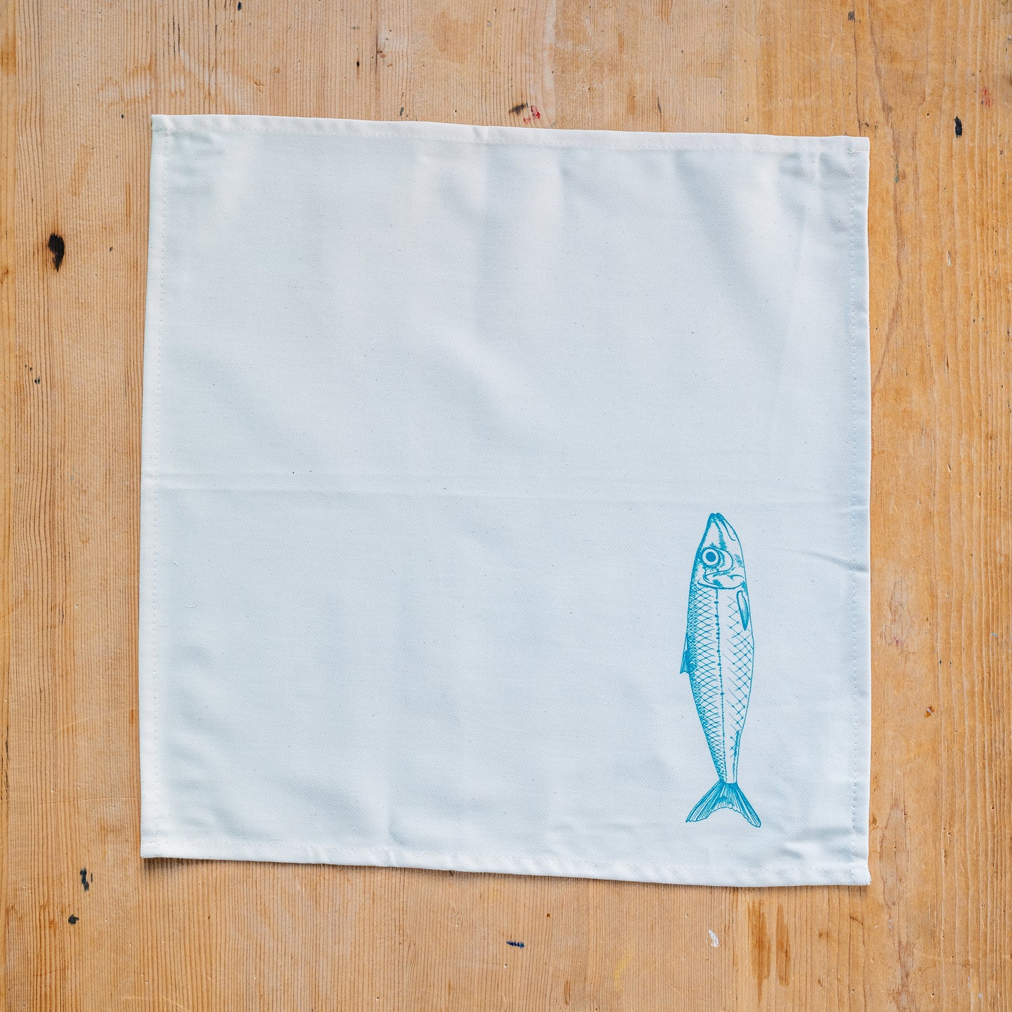 Seafood napkin gift set by Lottie Day featuring handprinted crab, blue lobster, prawn, mackerel, samphire and lemon illustrations on cotton napkins