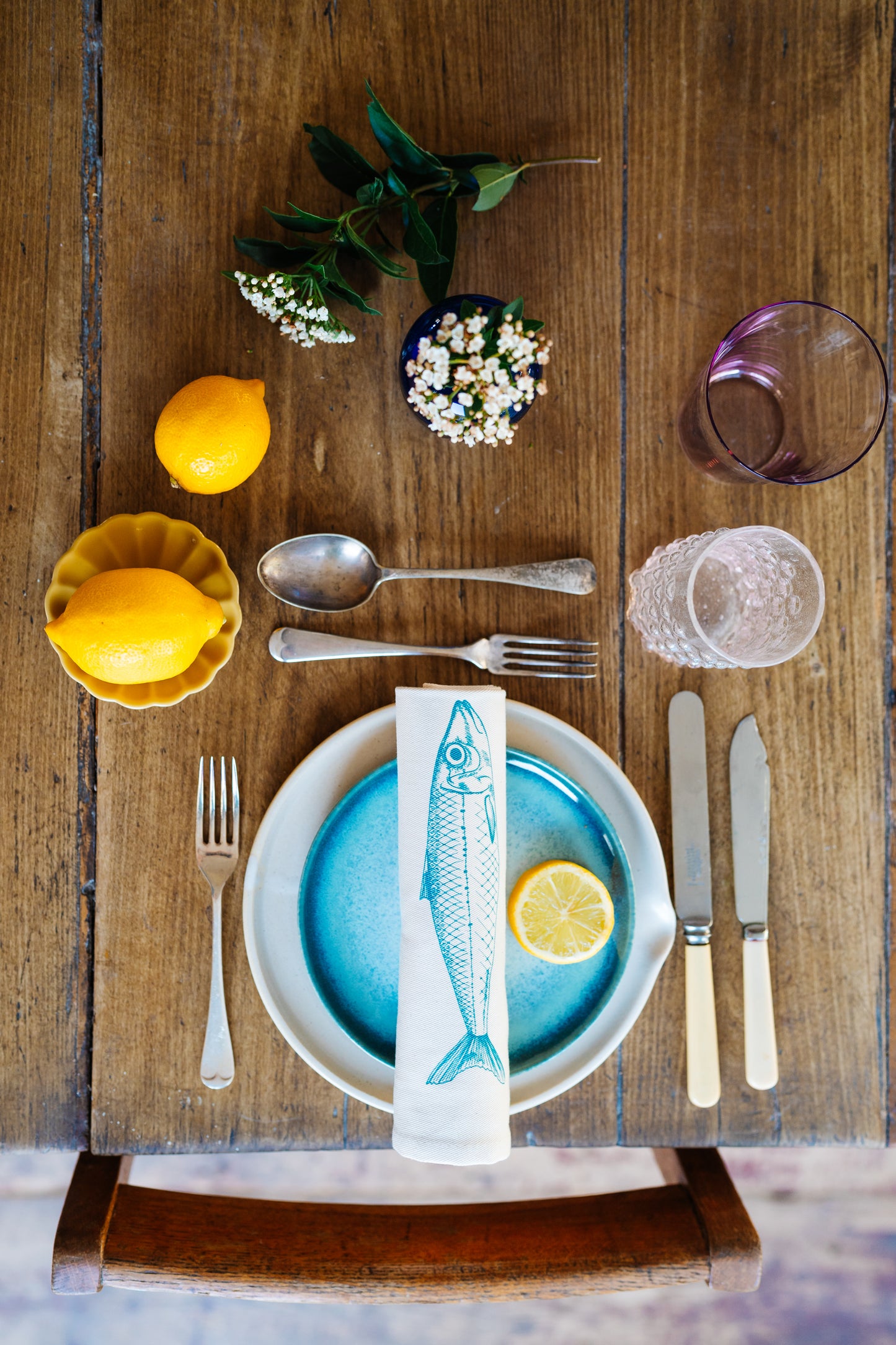 Seafood napkin gift set by Lottie Day featuring handprinted crab, blue lobster, prawn, mackerel, samphire and lemon illustrations on cotton napkins