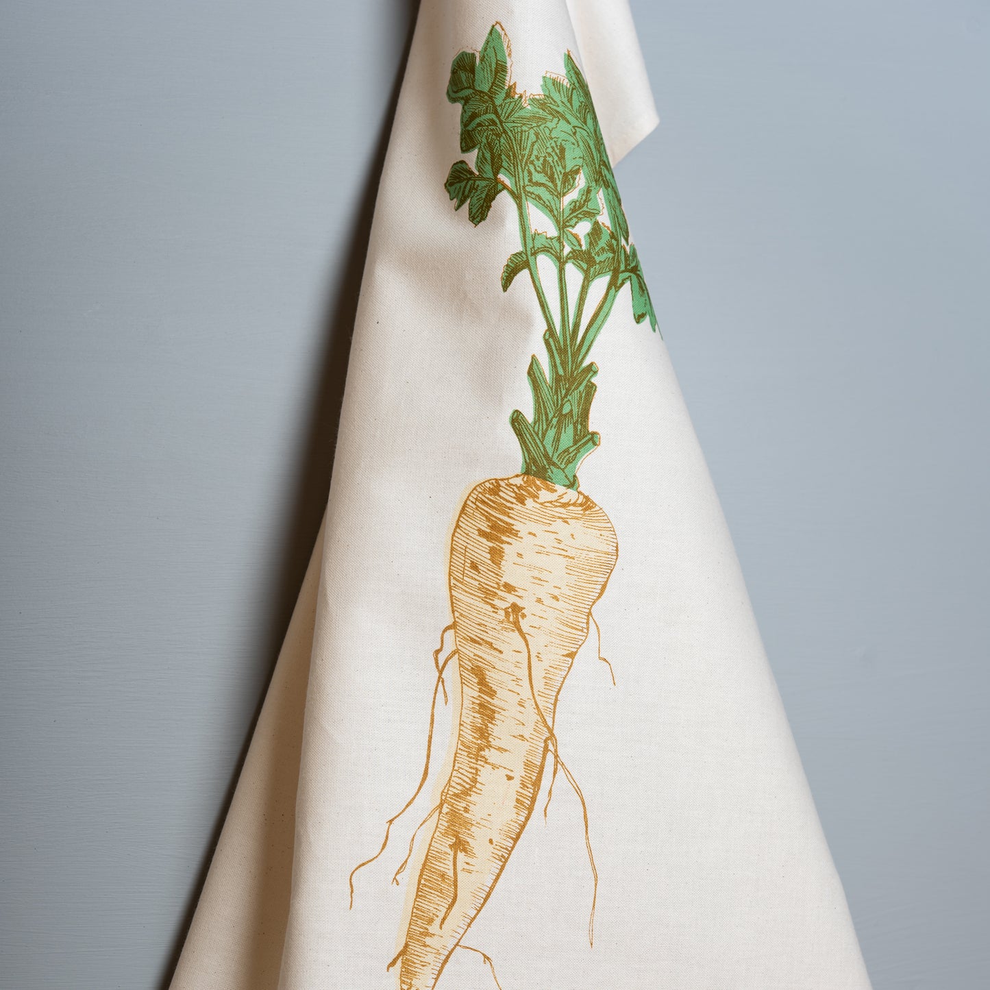 Parsnip vegetable tea towel by Lottie Day – hand-printed cotton dish towel featuring cream parsnip illustration, inspired by Norfolk allotments