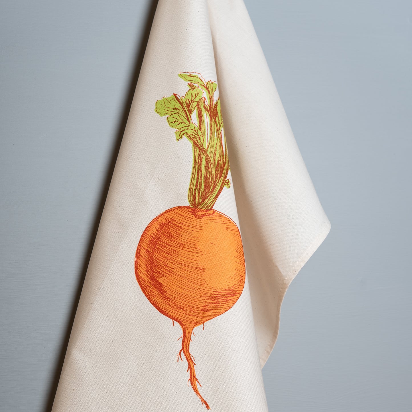 Orange Swede tea towel by Lottie Day – handmade cotton dish towel featuring root vegetable illustration, inspired by Norfolk allotments