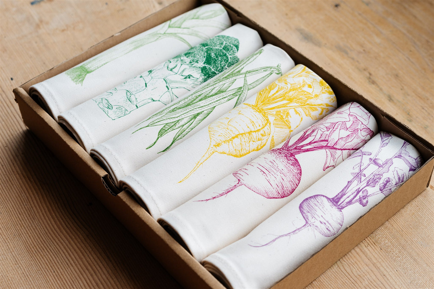 Allotment vegetable napkin set by Lottie Day - handmade cotton napkins featuring screen-printed garden vegetables including beetroot and leek