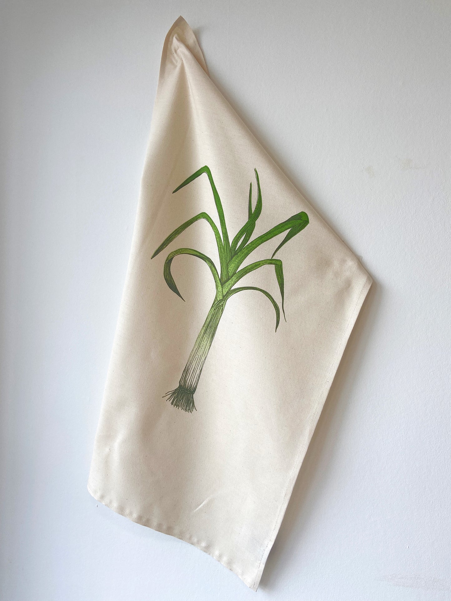 Leek tea towel by Lottie Day – handprinted cotton kitchen towel featuring Norfolk allotment-inspired vegetable illustration