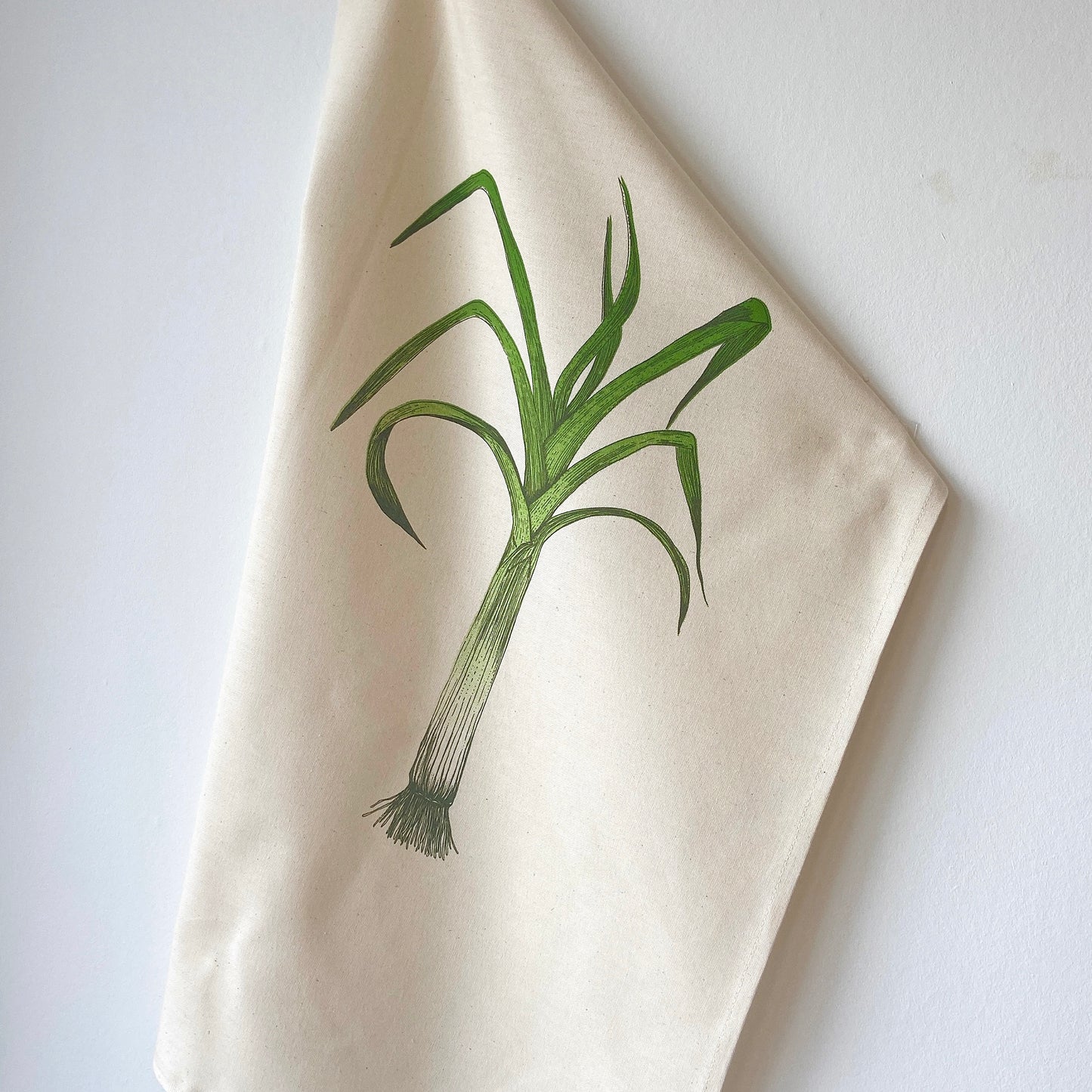 Leek tea towel by Lottie Day – handprinted cotton kitchen towel featuring Norfolk allotment-inspired vegetable illustration