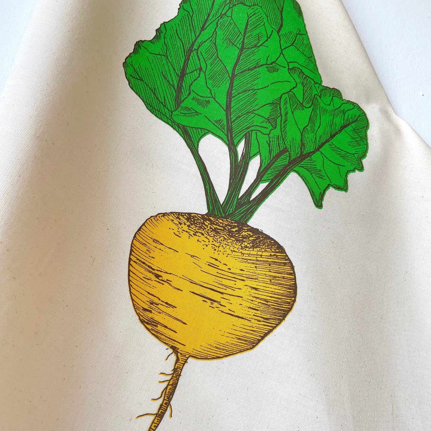 Golden Beet tea towel by Lottie Day – handprinted on cotton with allotment-inspired vegetable illustration, perfect for gardeners and cooks