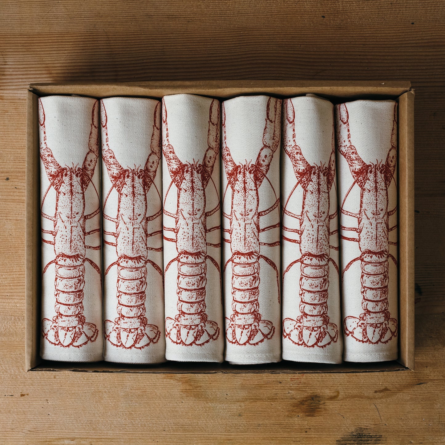 Red Lobster napkin gift set by Lottie Day – handmade cotton napkins with coastal seafood illustration, inspired by Norfolk