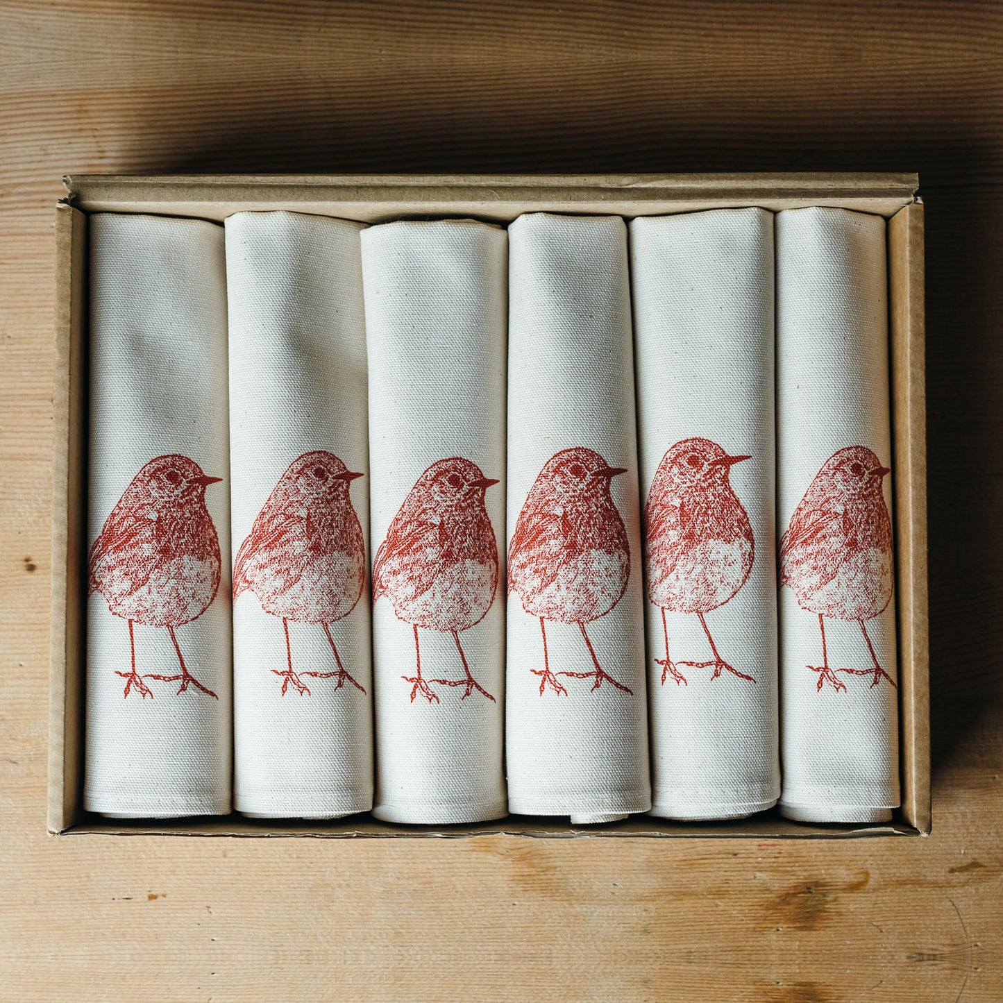 Christmas Robin napkin set by Lottie Day – screen-printed cotton napkins with festive red robin illustrations, handmade in Norfolk