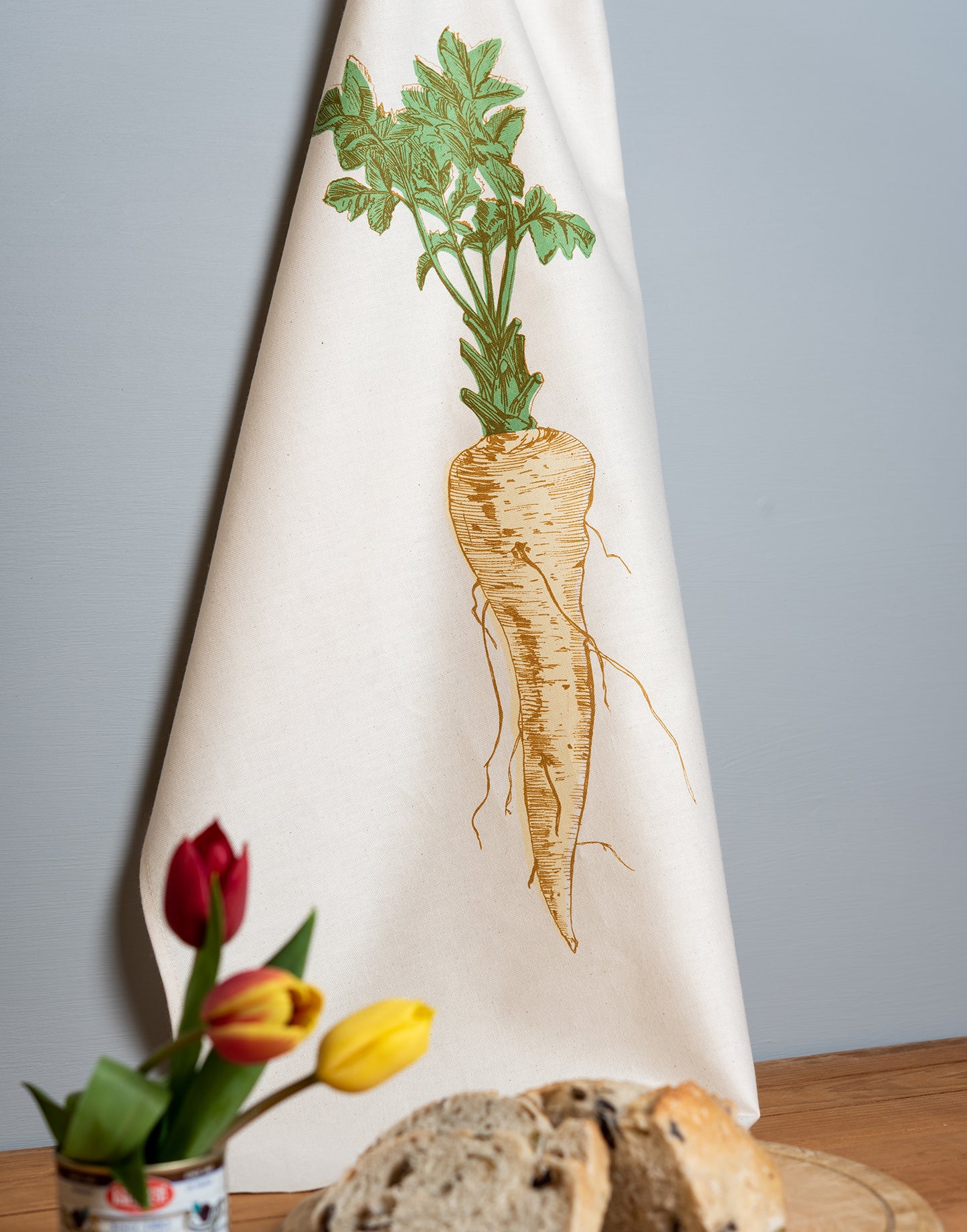 Parsnip vegetable tea towel by Lottie Day – hand-printed cotton dish towel featuring cream parsnip illustration, inspired by Norfolk allotments